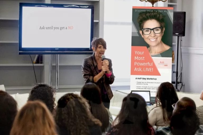 Image of Dia Bondi speaking on stage. She encourages us to "Enter the Zofo"